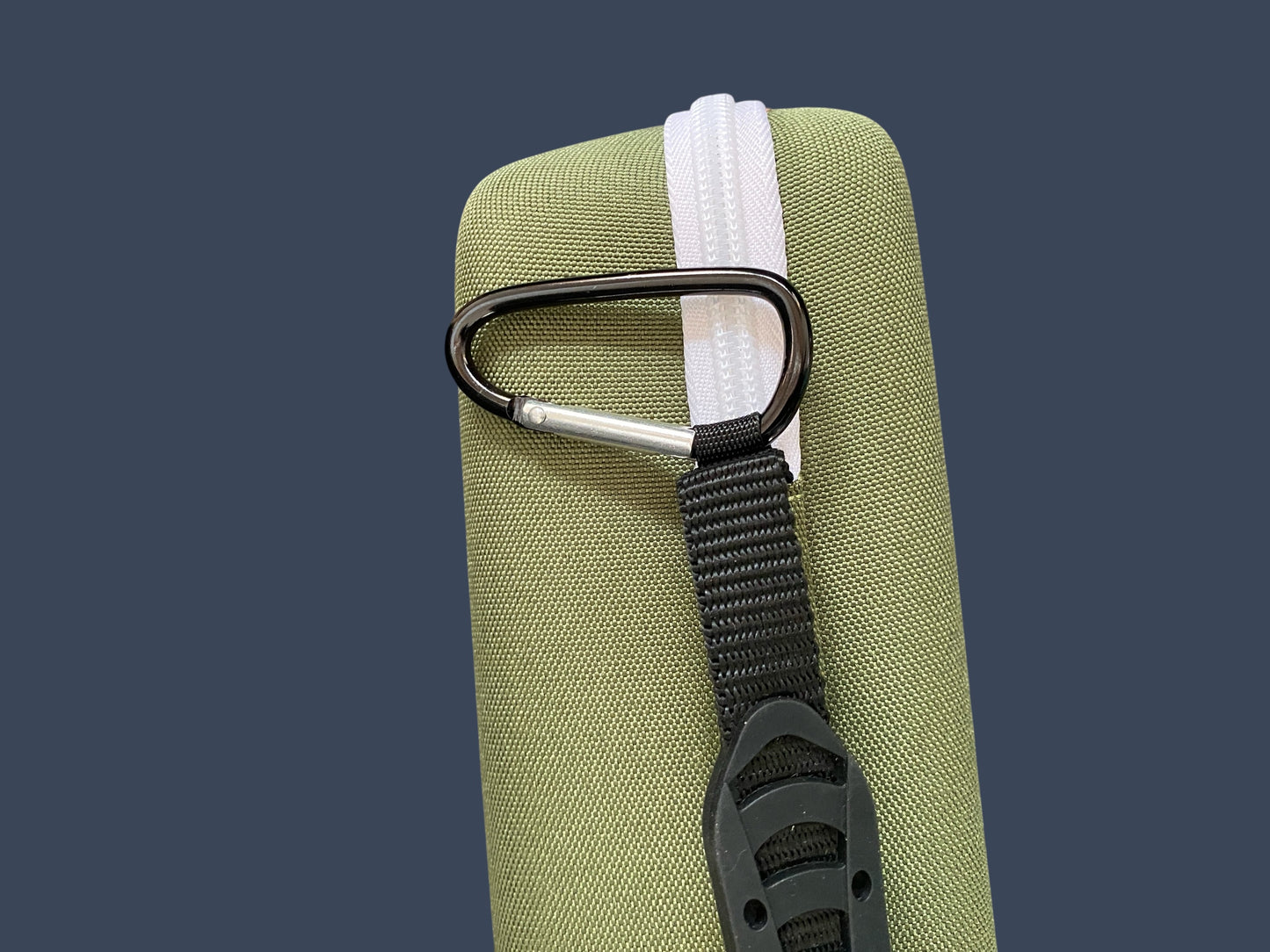 Green bag with a carabiner and strap on